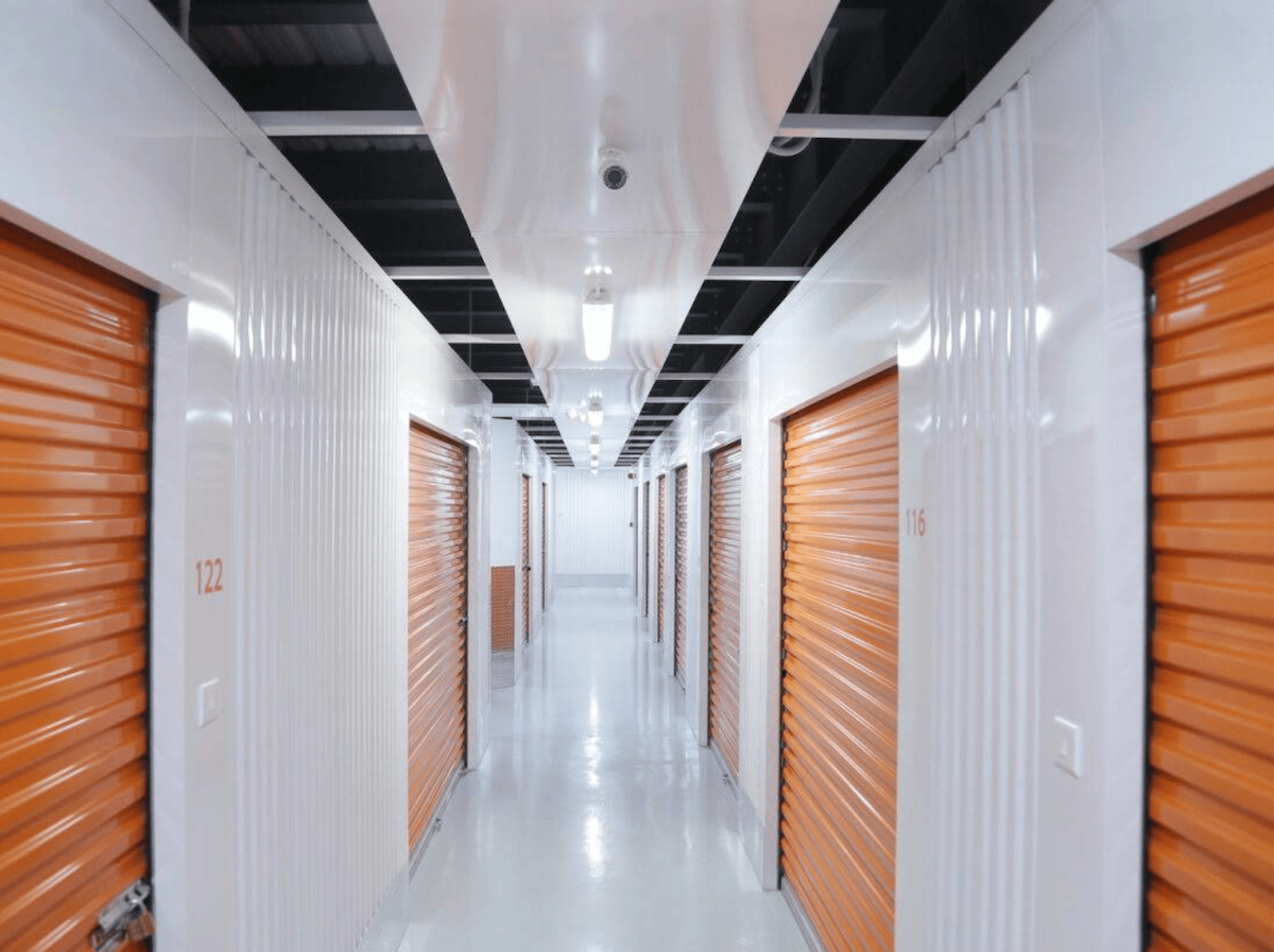 EasyStorage 8th Circle — interior corridor with orange storage unit doors