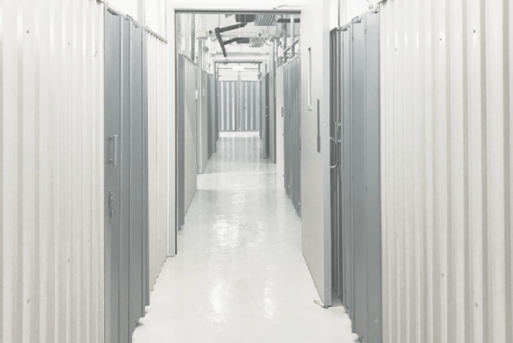 STORED! Southern District - Bright hallway with secure storage units